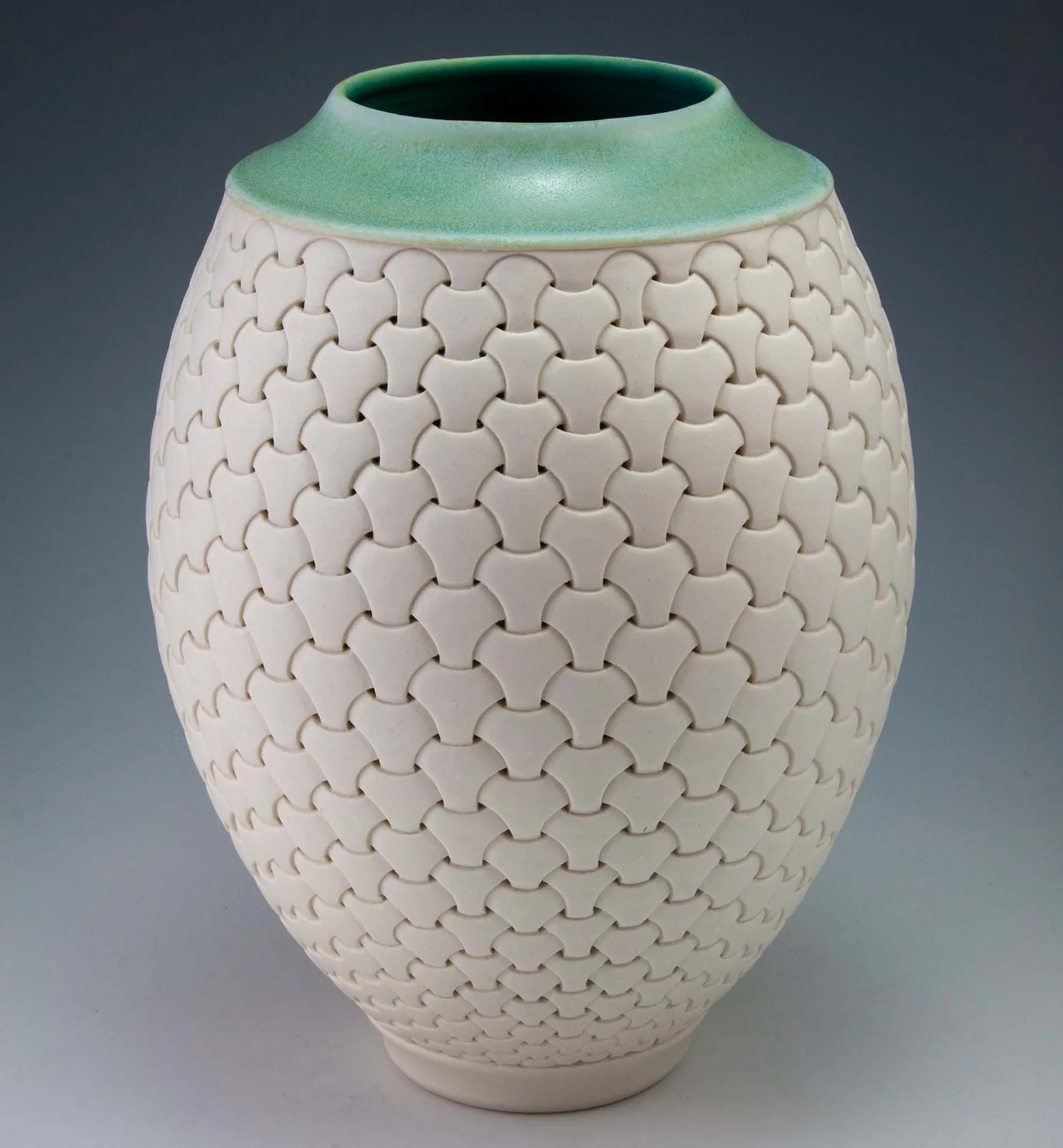 Shoji Pattern Vase: white porcelain carved in overlapping scales, green rim