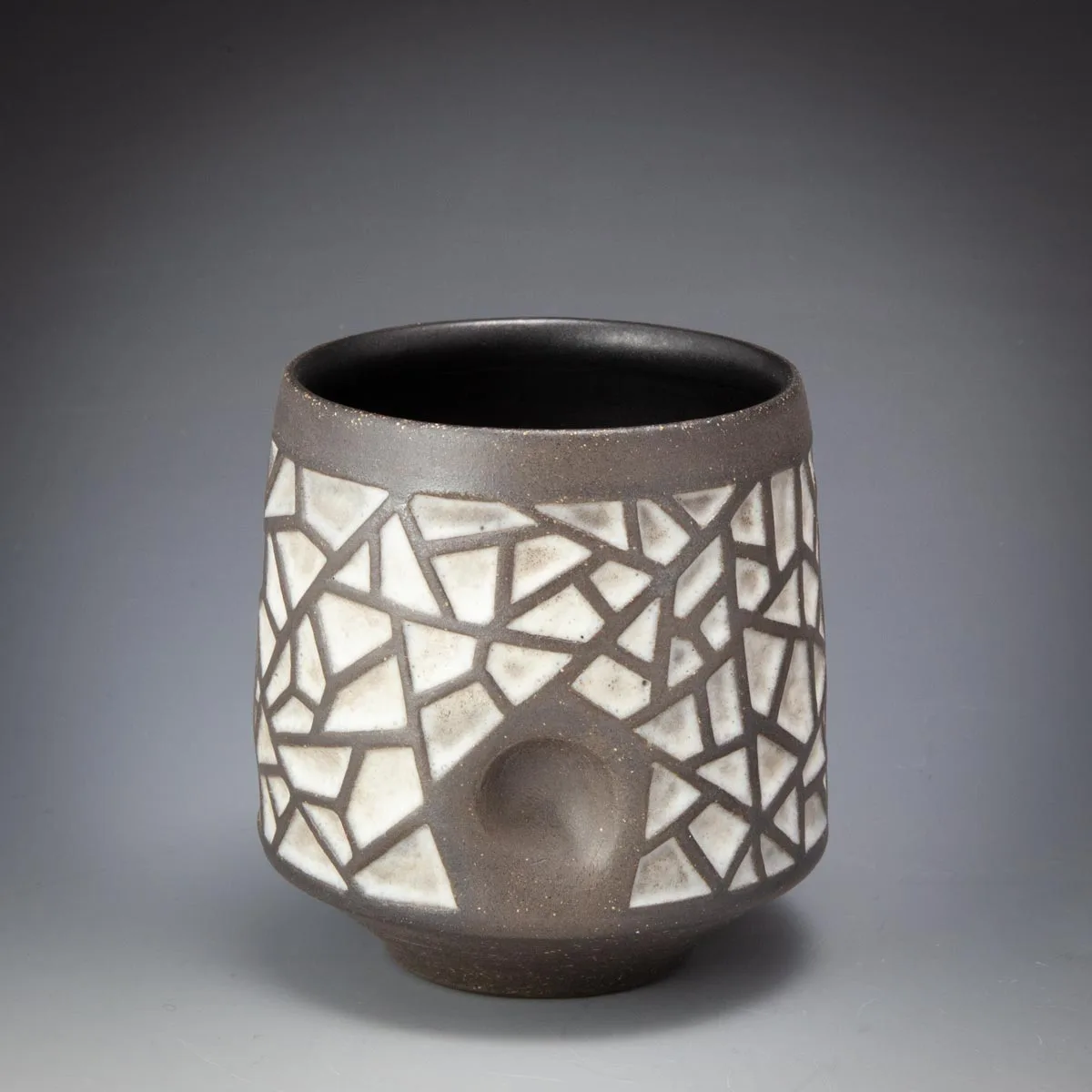 Cracked Ice Cup: dark cup carved with a white crackle pattern