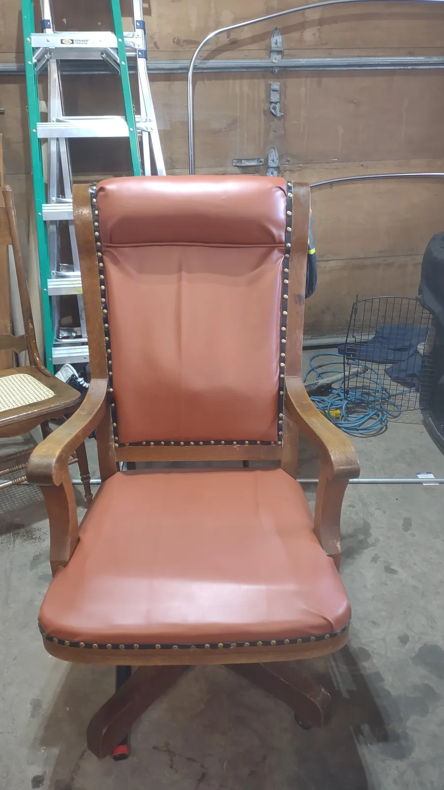 Wooden armchair reupholstered in tan, by Matsu Upholstery